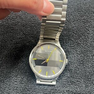 Nixon Silver Watch with Yellow Accents